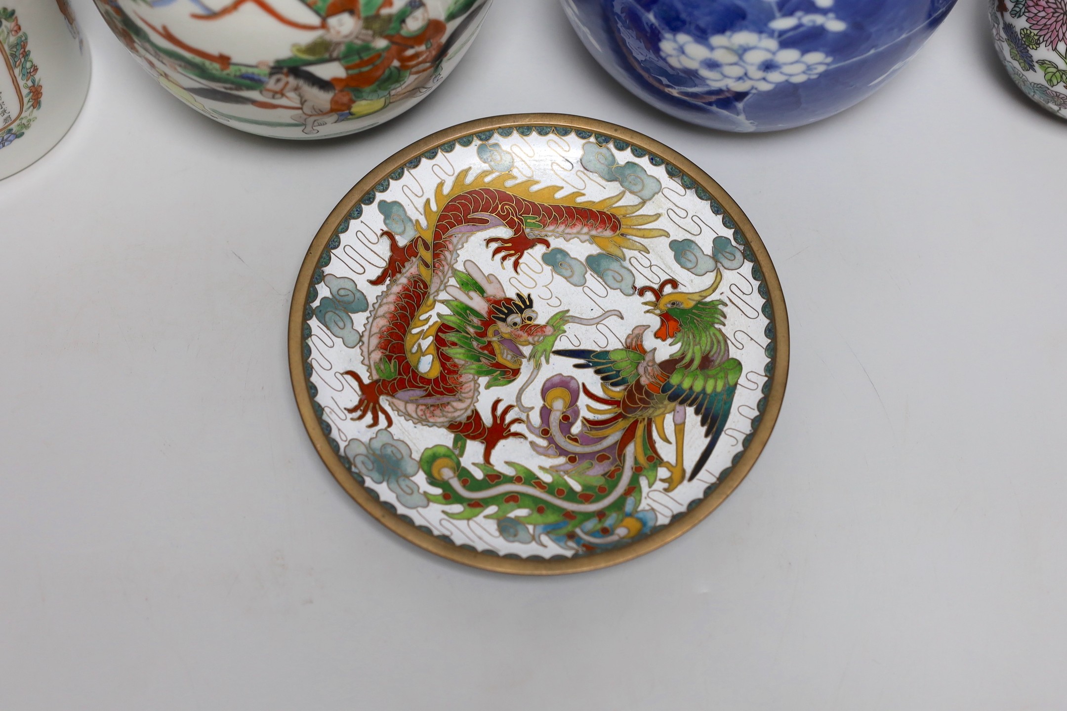 A 19th century Chinese famille rose box and cover, a blue and white prunus jar, two other jars, a figural brush rest and a cloisonne enamel dish